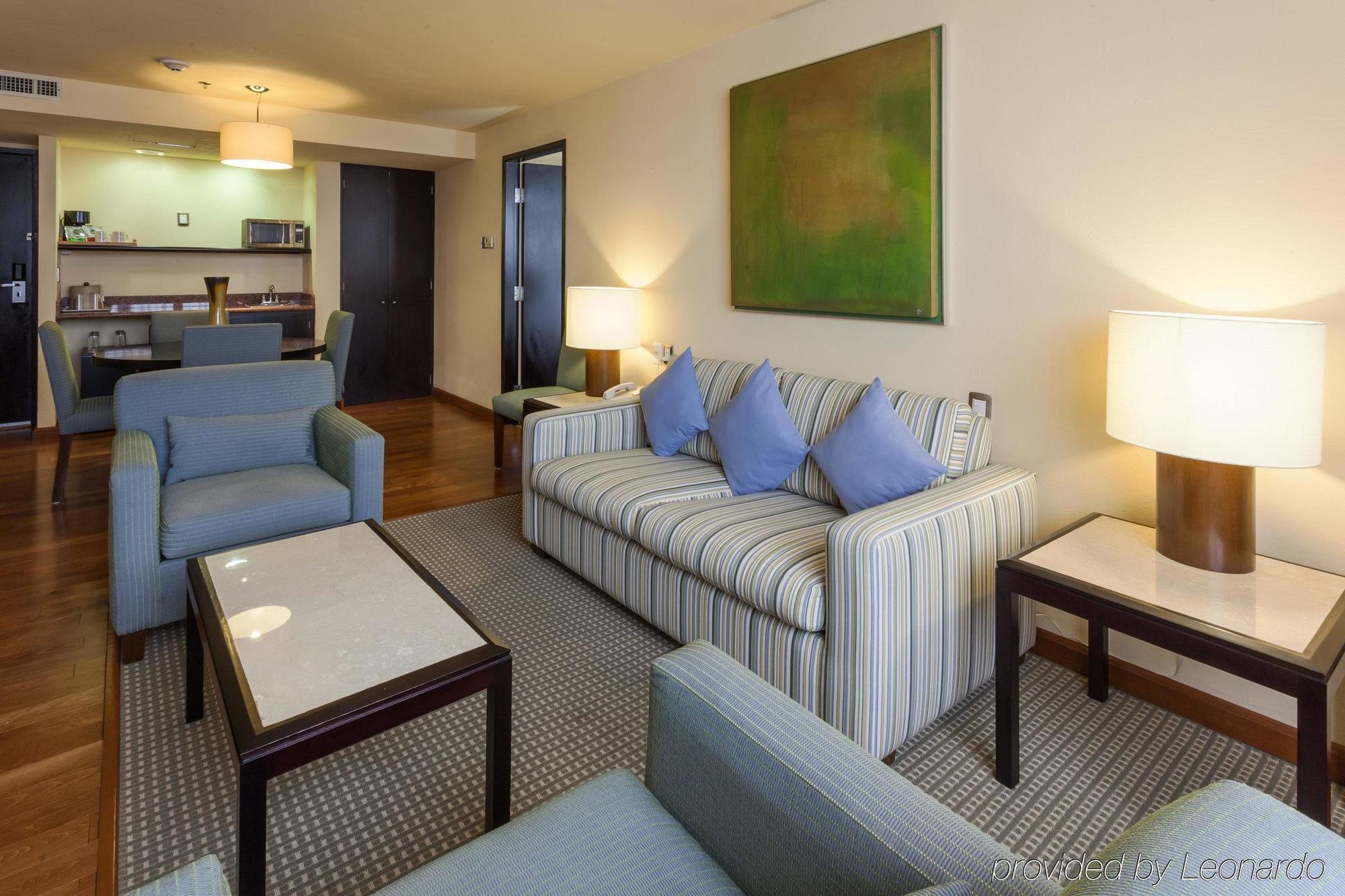 Gamma By Fiesta Americ Xalapa Nubara Exterior photo A living room in a suite at the hotel
